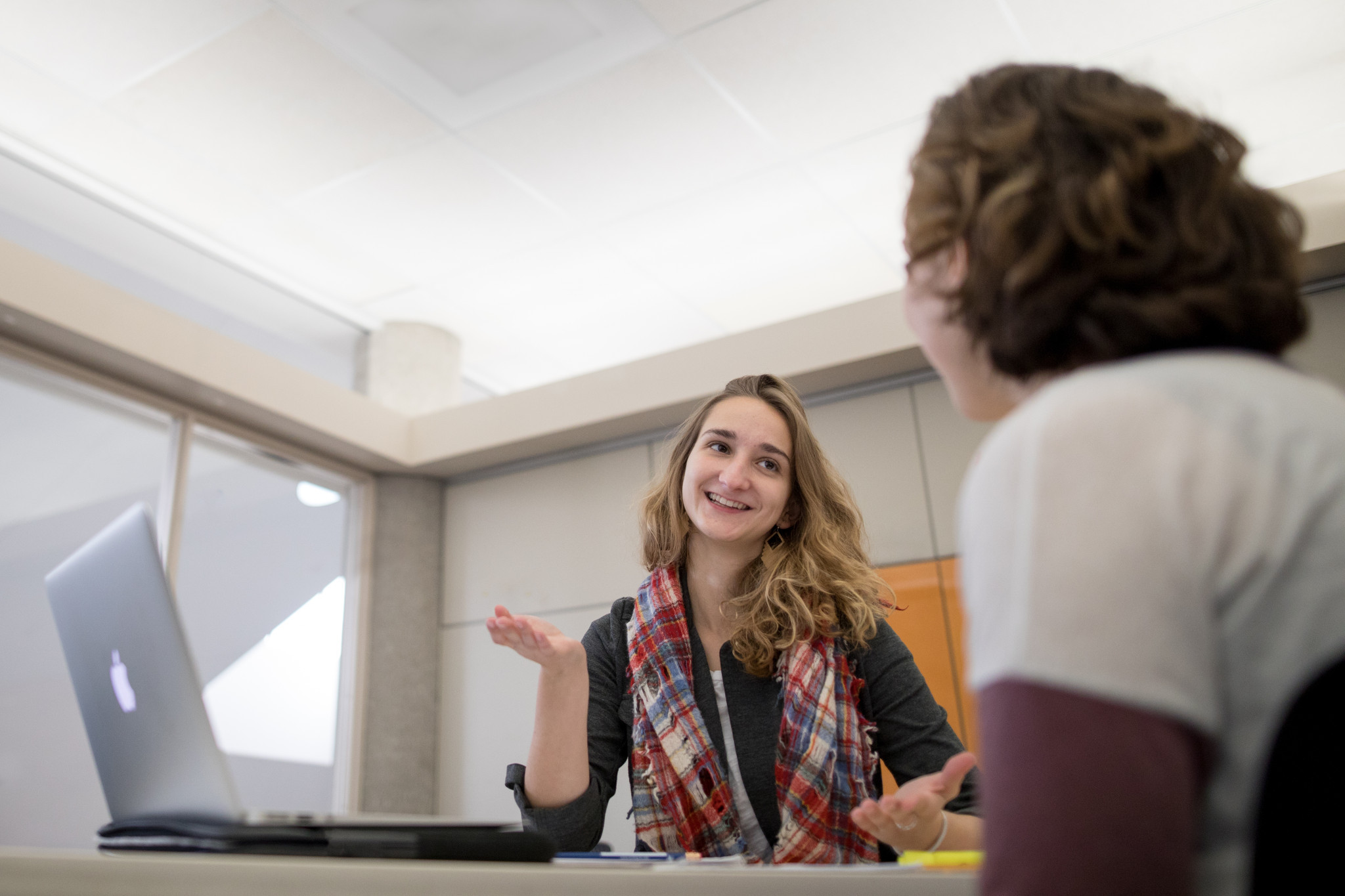 one student talks with another